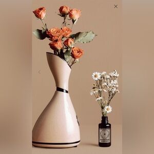 Cream colored Pro facial steaming system with measuring cup and infusion drops